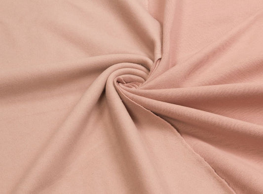 There is a light pink piece of fabric that is bunched in the middle.