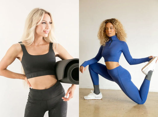 There is a woman in a black workout set holding a grey yoga mat. There is also a woman in a blue workout set with a high neck and white sneakers and grey socks.
